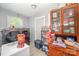 A well-organized laundry room features front-load machines, ample storage, and natural light from the window at 511 W Finger St, Maiden, NC 28650