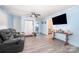 Open-concept living room featuring modern vinyl flooring and fresh, light blue paint at 511 W Finger St, Maiden, NC 28650