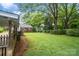 Expansive backyard with mature trees and lush lawn, offering a serene and private outdoor space at 512 Forest Ln, Rock Hill, SC 29730