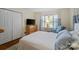 Relaxing bedroom with a white bed, blue accents, and a dresser with a television at 512 Forest Ln, Rock Hill, SC 29730