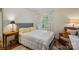 Bright bedroom featuring a comfortable bed, stylish curtains, and a cozy armchair at 512 Forest Ln, Rock Hill, SC 29730