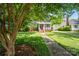 Lovely brick home with inviting front porch, surrounded by mature trees and a well-kept lawn at 512 Forest Ln, Rock Hill, SC 29730