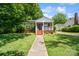 Charming brick home featuring a covered front porch and well-maintained landscaping, perfect curb appeal at 512 Forest Ln, Rock Hill, SC 29730