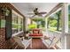 Inviting front porch with comfortable seating, ceiling fan, and classic white railing, perfect for relaxing at 512 Forest Ln, Rock Hill, SC 29730