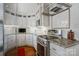 Modern kitchen featuring stainless steel appliances, granite countertops, and white cabinets at 512 Forest Ln, Rock Hill, SC 29730