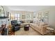 Spacious living room with a large sectional sofa, fireplace, and natural light from shuttered windows at 512 Forest Ln, Rock Hill, SC 29730