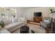 Bright living room featuring hardwood floors, a comfortable sofa, and elegant details throughout at 512 Forest Ln, Rock Hill, SC 29730