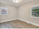 Clean bedroom with modern flooring, neutral walls, and ample natural light at 5715 Coulee Pl, Charlotte, NC 28217
