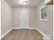 Well-lit room with fresh paint, modern flooring, and natural light at 5715 Coulee Pl, Charlotte, NC 28217