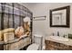 Bathroom featuring a furniture-style vanity with a marble countertop and an artistic shower curtain at 6650 Highway 341 Hwy, Kershaw, SC 29067