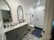 Stylish bathroom featuring a double sink vanity, black and white patterned tile, and a glass shower at 6650 Highway 341 Hwy, Kershaw, SC 29067