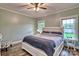 Cozy bedroom with wood floors, ceiling fan, and natural light from two windows at 6650 Highway 341 Hwy, Kershaw, SC 29067