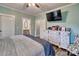 Bedroom with a large dresser and TV, chair and ensuite bathroom at 6650 Highway 341 Hwy, Kershaw, SC 29067
