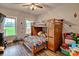 A bedroom with a wooden bunk bed, plenty of natural light, and wood-look floors at 6650 Highway 341 Hwy, Kershaw, SC 29067