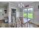 Dining room featuring a modern chandelier, ample natural light, and access to the backyard at 6650 Highway 341 Hwy, Kershaw, SC 29067