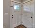 Bright entryway with clean lines, featuring a stylish front door and modern interior doors at 6650 Highway 341 Hwy, Kershaw, SC 29067