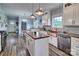 Bright kitchen featuring a copper farmhouse sink, stainless steel appliances, butcher block island, and white cabinets at 6650 Highway 341 Hwy, Kershaw, SC 29067