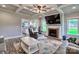 Cozy living room with a fireplace, coffered ceilings, and a view into the kitchen at 6650 Highway 341 Hwy, Kershaw, SC 29067