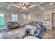 Bright living room showcasing stylish decor, wood-look floors, and a decorative ceiling at 6650 Highway 341 Hwy, Kershaw, SC 29067