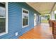 Covered porch with blue vinyl siding at 6650 Highway 341 Hwy, Kershaw, SC 29067