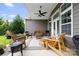 Relaxing back porch featuring comfortable seating, ceiling fan, and outdoor charm at 7016 Bareland Rd, Fort Mill, SC 29707