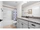 Bright bathroom featuring granite countertops, white cabinets, and a shower-tub combination at 7016 Bareland Rd, Fort Mill, SC 29707