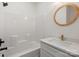 Bathroom features a shower/tub combo with a white surround, a modern vanity, and sleek fixtures at 705 Sunderland Sw Rd, Concord, NC 28027