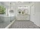 Elegant bathroom featuring freestanding tub, patterned tile, and stylish fixtures at 7166 Dove Field Ln, Fort Mill, SC 29707