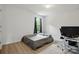 This bedroom features wood floors, bright light, and ample space at 7166 Dove Field Ln, Fort Mill, SC 29707