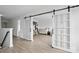 Upstairs landing showing large sliding barn doors accessing bedroom at 7166 Dove Field Ln, Fort Mill, SC 29707