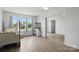 Bright bedroom with luxury vinyl flooring, large windows, and modern style at 7166 Dove Field Ln, Fort Mill, SC 29707