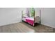This bedroom features wood floors, bright light, and ample space at 7166 Dove Field Ln, Fort Mill, SC 29707
