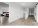 Bright hallway showcasing an open bedroom and sleek barn doors at 7166 Dove Field Ln, Fort Mill, SC 29707