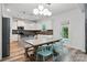 Beautiful eat-in kitchen features white cabinets, stainless appliances, and a dining table at 7166 Dove Field Ln, Fort Mill, SC 29707