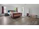 Primary bedroom suite with sitting area and open access to primary bathroom at 7166 Dove Field Ln, Fort Mill, SC 29707