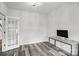 Well-lit home office with luxury vinyl flooring, French doors, and minimalist decor at 7166 Dove Field Ln, Fort Mill, SC 29707