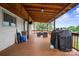 Covered porch with wooden ceiling, furniture, and grill at 806 N Central Ave, Locust, NC 28097