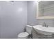 Simple and clean bathroom with a white toilet and a vanity sink at 806 N Central Ave, Locust, NC 28097
