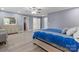 Comfortable bedroom with wood floors and neutral colors, showing attached bathroom access at 806 N Central Ave, Locust, NC 28097