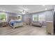 Spacious bedroom featuring neutral decor, two windows, and a ceiling fan at 806 N Central Ave, Locust, NC 28097
