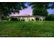 Charming one-story home with a well-manicured lawn and mature trees offering a serene outdoor setting at 806 N Central Ave, Locust, NC 28097