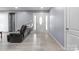 Bright living room featuring wood-look floors and a stylish entryway with a glass detailed front door at 806 N Central Ave, Locust, NC 28097