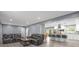 Open-concept living area that flows into a kitchen with an island and stainless steel appliances at 806 N Central Ave, Locust, NC 28097