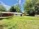 Expansive backyard with lush greenery and mature trees at 820 Kerley Ct, Statesville, NC 28677