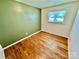 Comfortable bedroom featuring wood-look flooring and a window at 820 Kerley Ct, Statesville, NC 28677