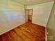 Bright bedroom with neutral walls, wood-look flooring and a closet at 820 Kerley Ct, Statesville, NC 28677