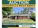 Charming brick ranch-style home with a well-maintained front yard, now available at online auction at 820 Kerley Ct, Statesville, NC 28677