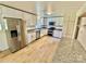 Modern kitchen with stainless steel appliances, granite countertops, and ample cabinet space at 820 Kerley Ct, Statesville, NC 28677