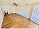 Living room featuring wood-look floors and a white brick wall at 820 Kerley Ct, Statesville, NC 28677