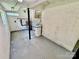 Utility room featuring painted brick wall, concrete flooring and utility equipment at 820 Kerley Ct, Statesville, NC 28677
